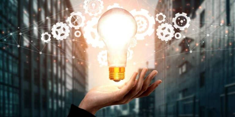 Innovation for Business Growth displayed by a person holding an elevating lightbulb.