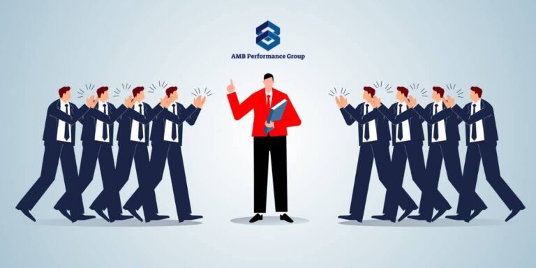 Illustration of a business leader in red surrounded by clapping team members, representing autocratic leadership and authoritative direction