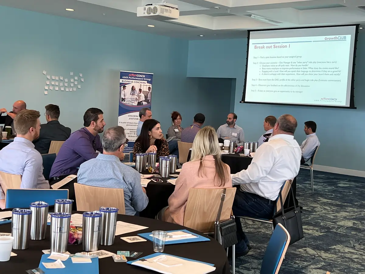 Business owners participating in breakout session during group coaching workshop