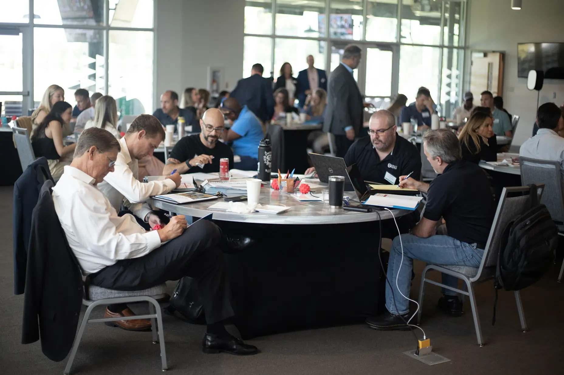 Business owners participating in group coaching workshop focused on growth planning